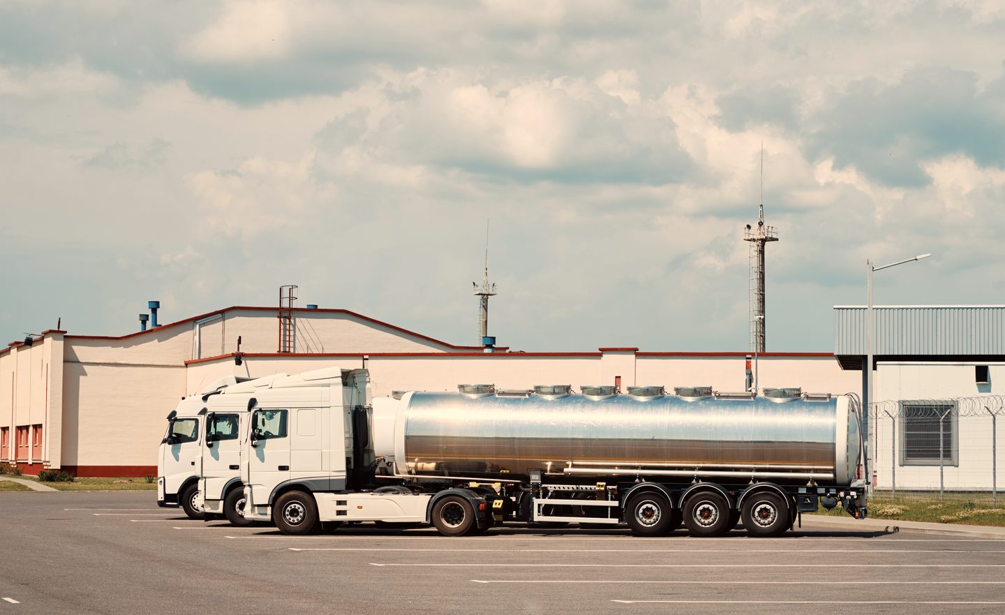 Trucks parked at a warehouse yard